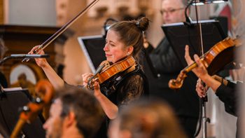 Group of violinists on stage