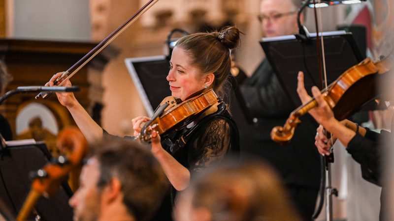 Group of violinists on stage