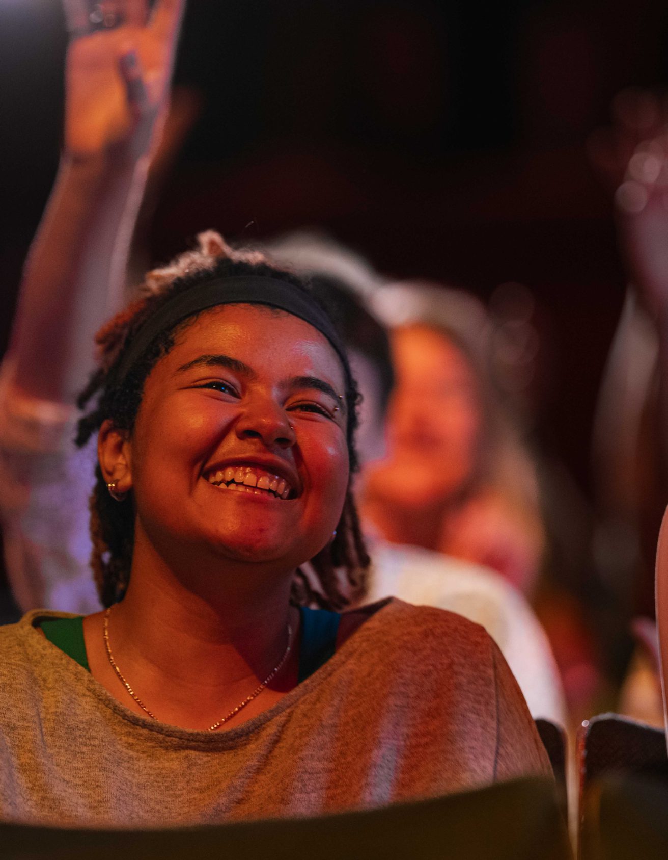 Smiling girl looking at the stage