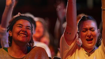 Smiling girl looking at the stage