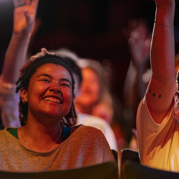 Smiling girl looking at the stage