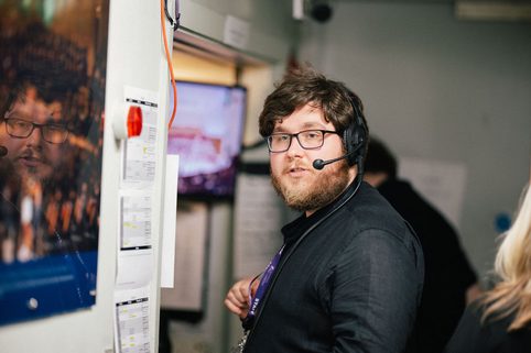 Staff member wearing headset backstage at Liverpool Philharmonic Hall