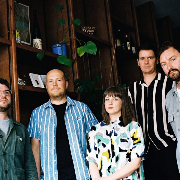members of Admiral Fallow standing in a row looking into the camera with a serious expression
