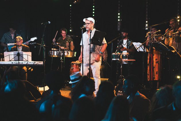 Members of Orchestra Mambo International performing live on stage