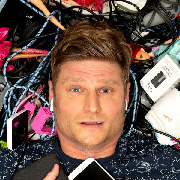 Image of Scott Bennett laying in the floor surrounded by gadgets