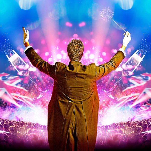 Back of conductor in tails, with pink and blue colours and union jack and audience imagery visible in front