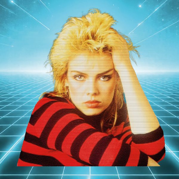 80s image of Kim Wilde with blonde hair and wearing a red and black striped jumper, in front of a grid dancefloor scene