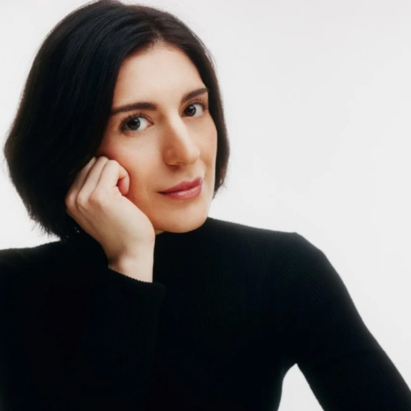 Mariam Batsashvilli, a white woman with short black hair, wearing a black turtleneck leaning on her right hand