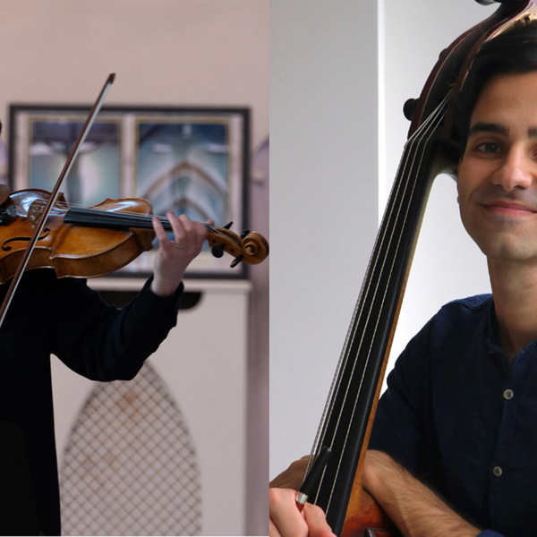 One musician stood on the left side playing the viola and looking down, another musician to the right side holding their instrument and smiling at the camera