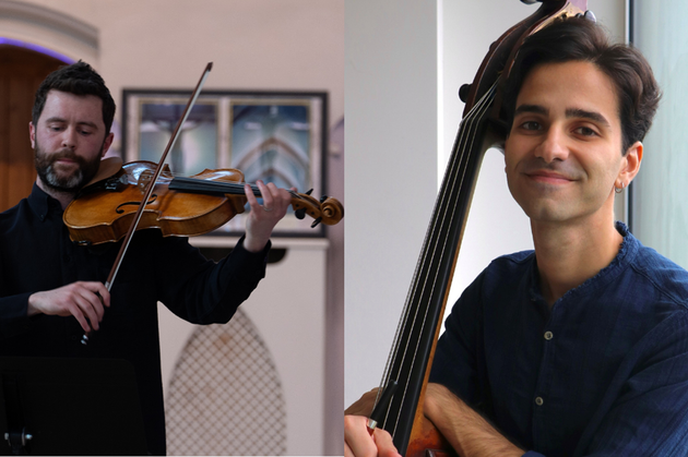 One musician stood on the left side playing the viola and looking down, another musician to the right side holding their instrument and smiling at the camera